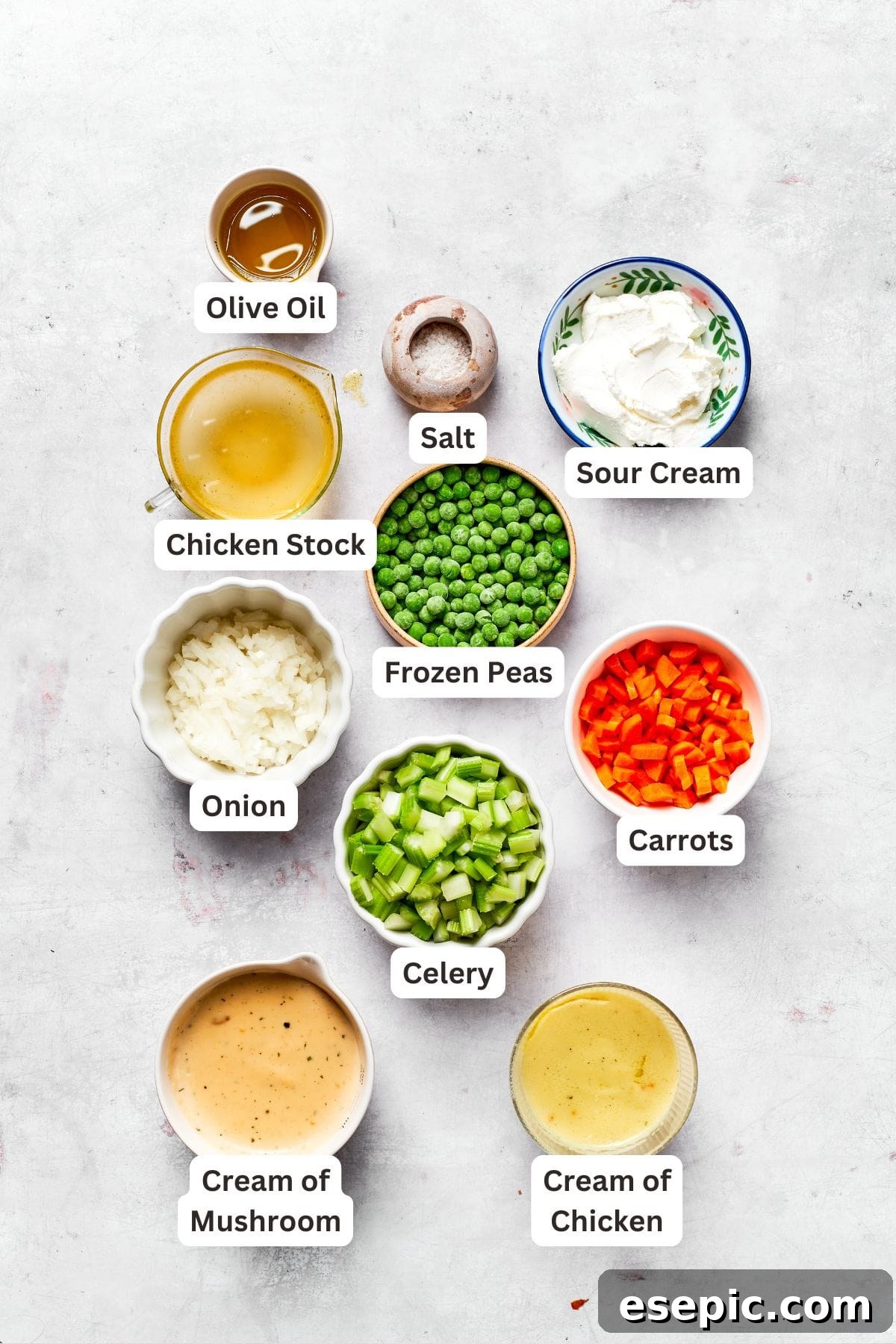 A bowl of creamy chicken filling with vegetables, pre-baking.