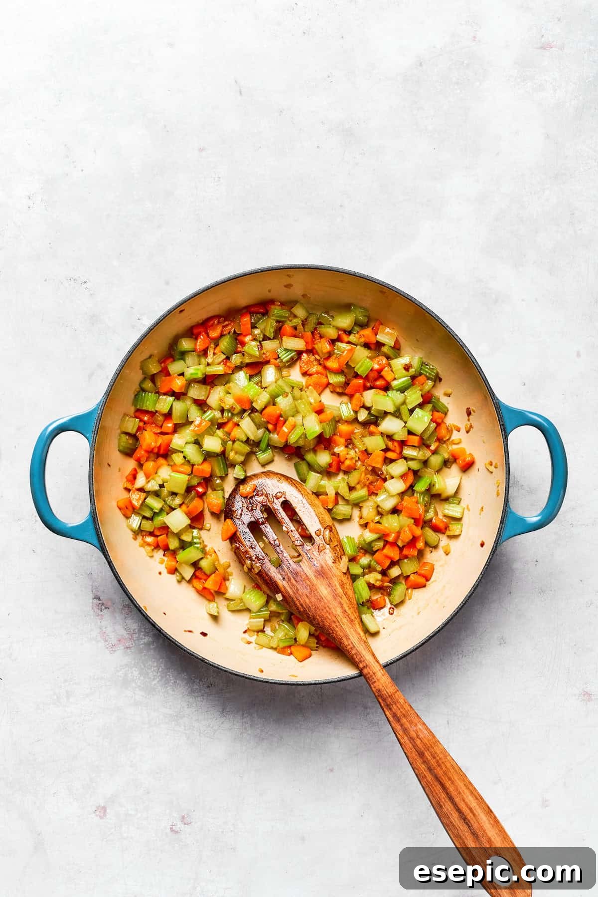 Cooked vegetables in a pot, softened and ready for the next steps.
