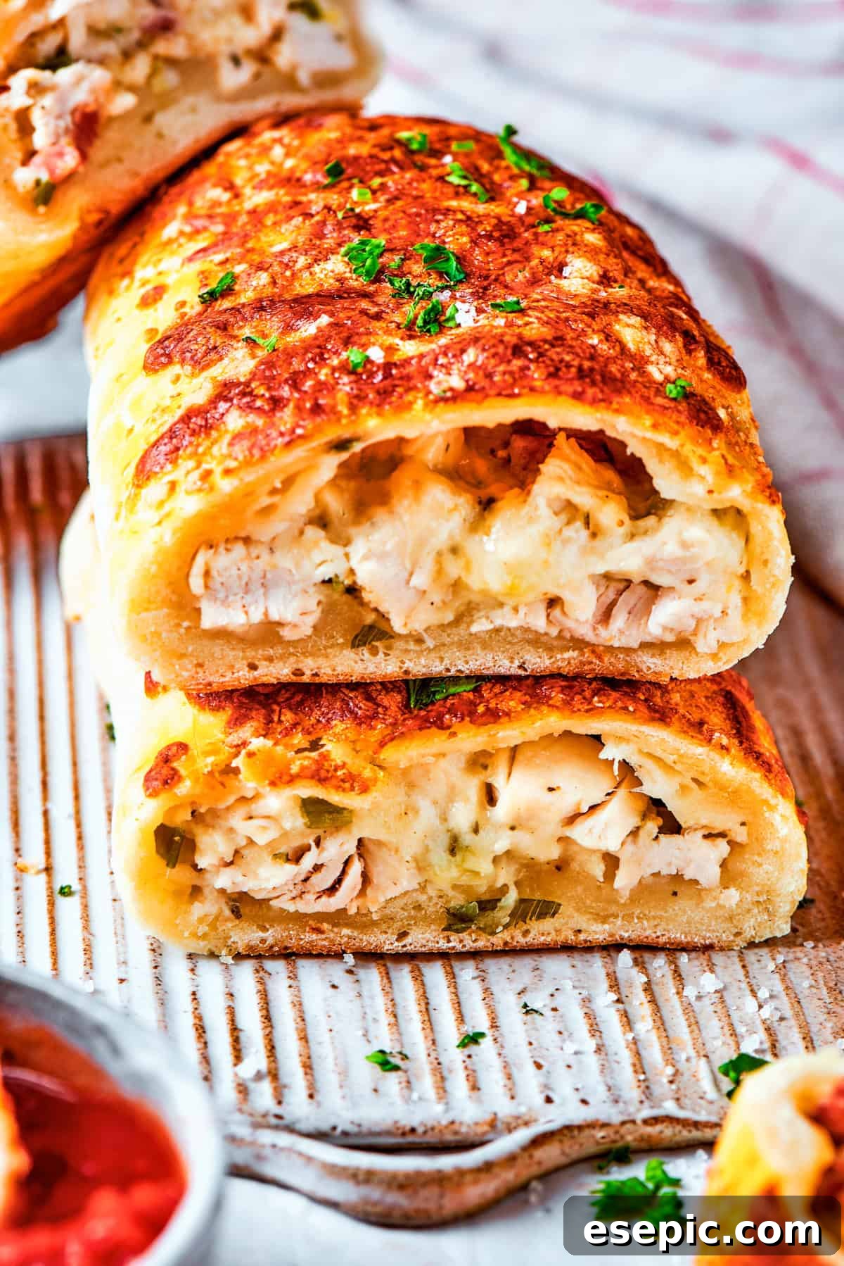 Costco chicken bake is cut in half to show the inside.