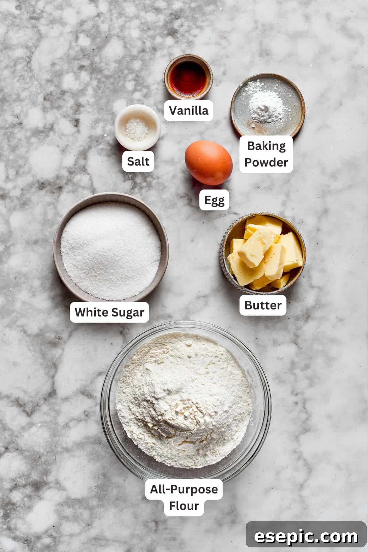 A collection of ingredients for melted snowman cookies, neatly arranged and ready for baking.