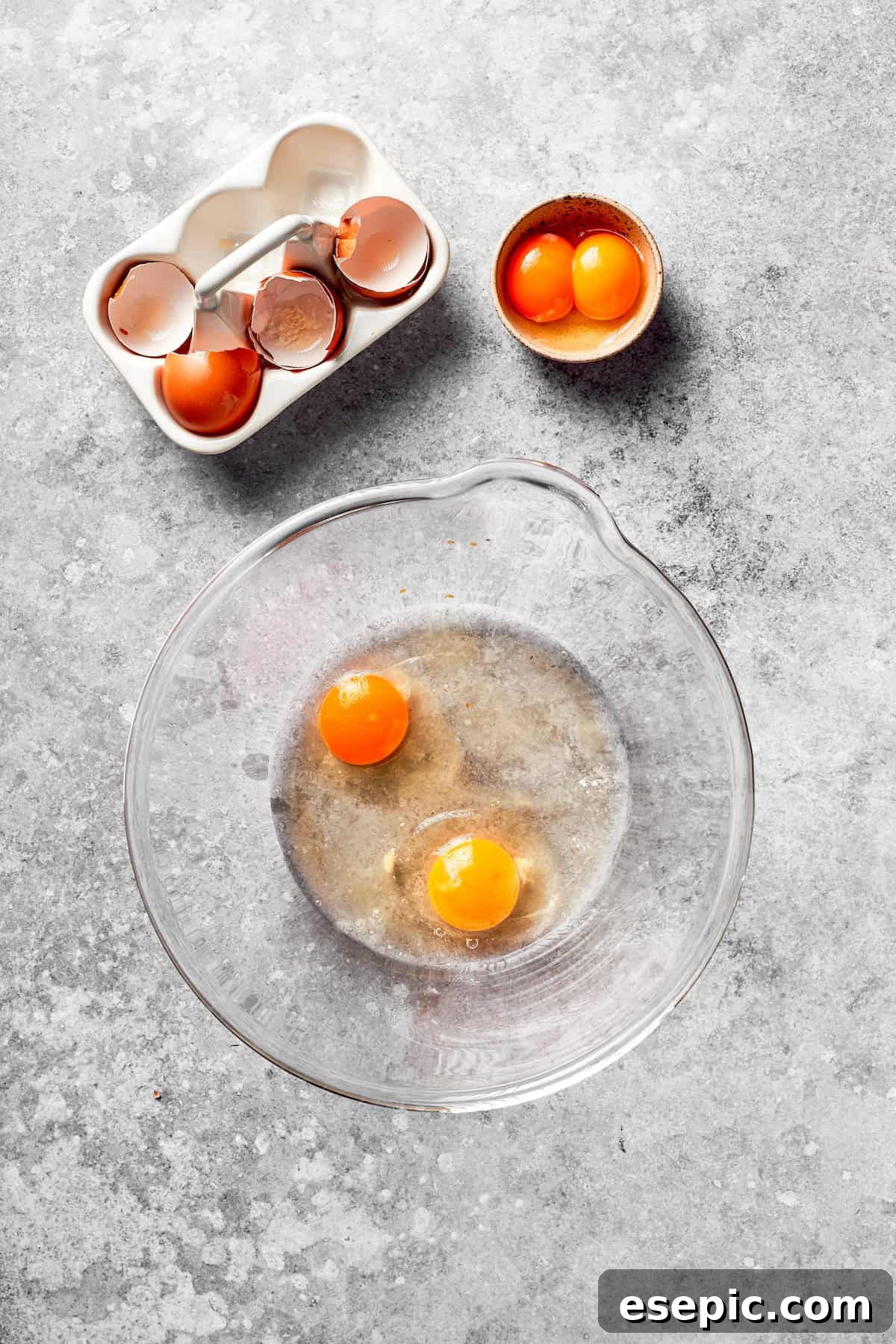 Eggs cracked in a bowl, ready to be whisked for the cake batter.