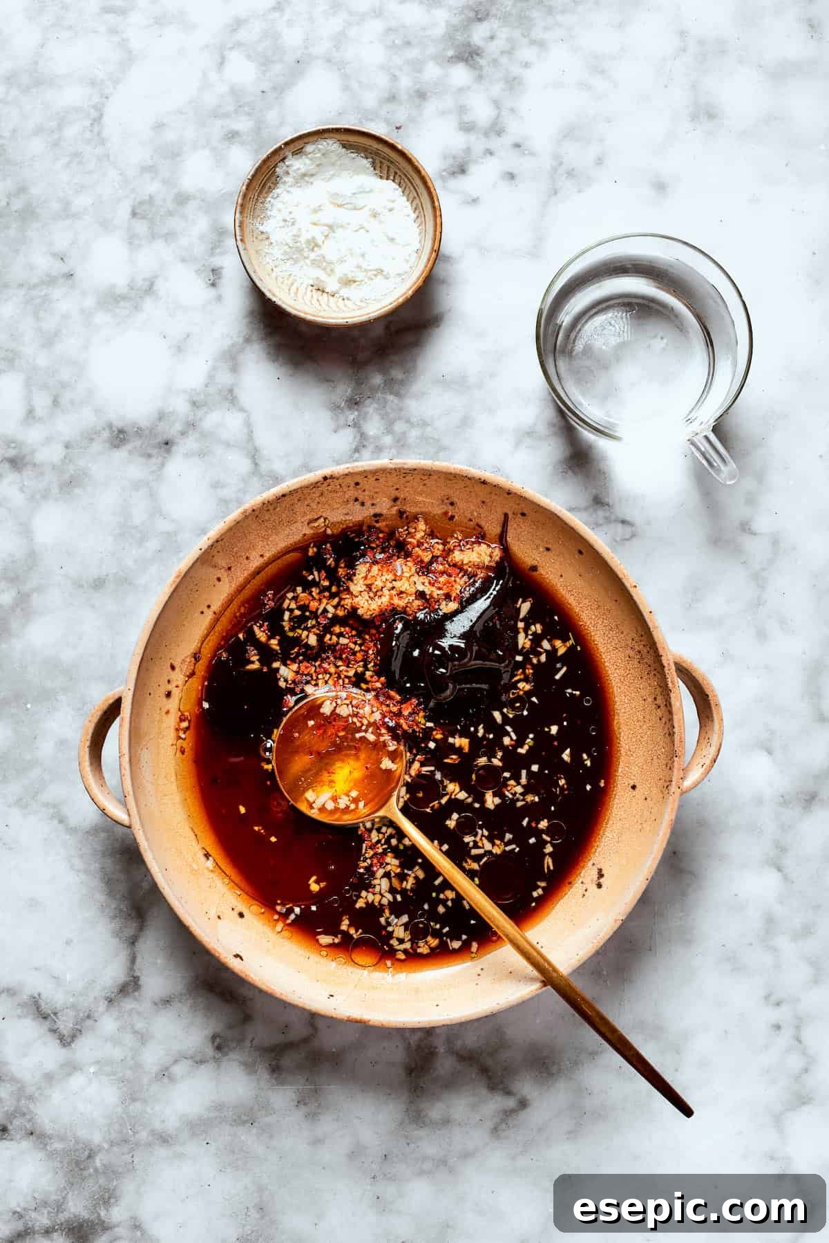 My teriyaki salmon recipe glazes flaky salmon with a homemade sticky-sweet marinade that adds tons of flavor. All teriyaki sauce ingredients combined in a mixing bowl.