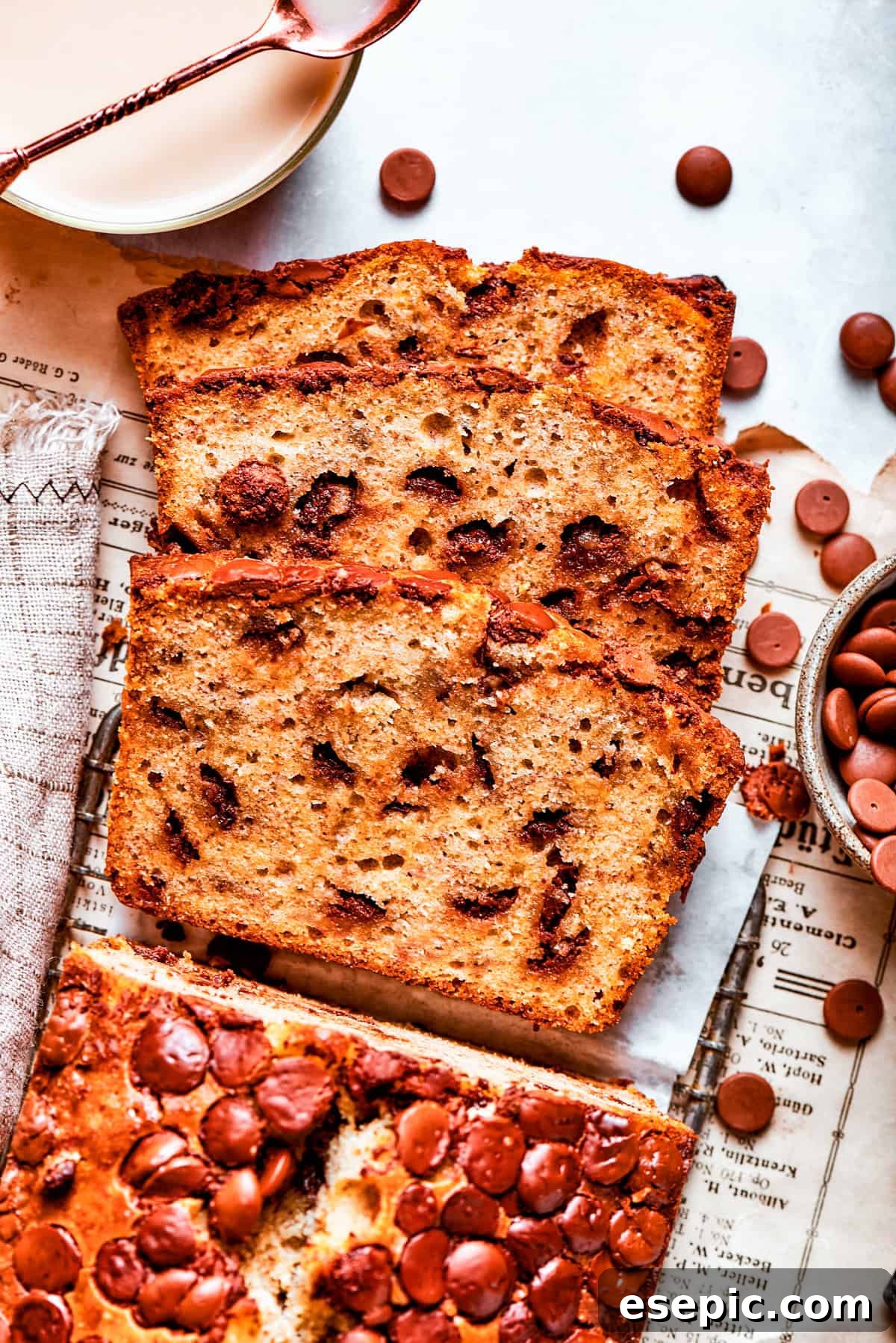 Sliced loaf of banana bread with chocolate chips.