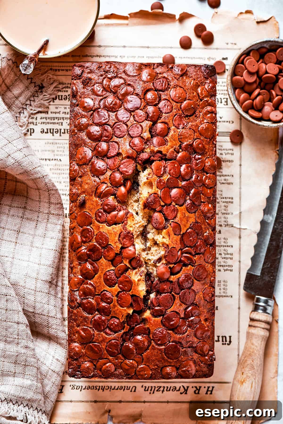 Overhead shot of chocolate chip banana bread set on a table.