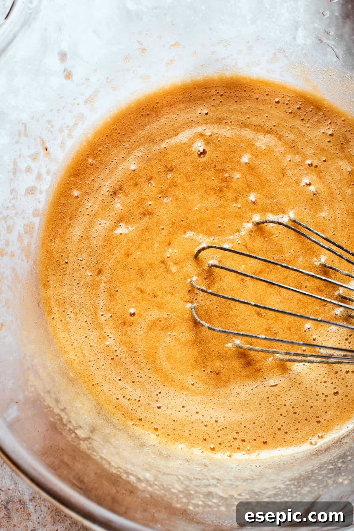 A whisk is used to make a smooth batter.