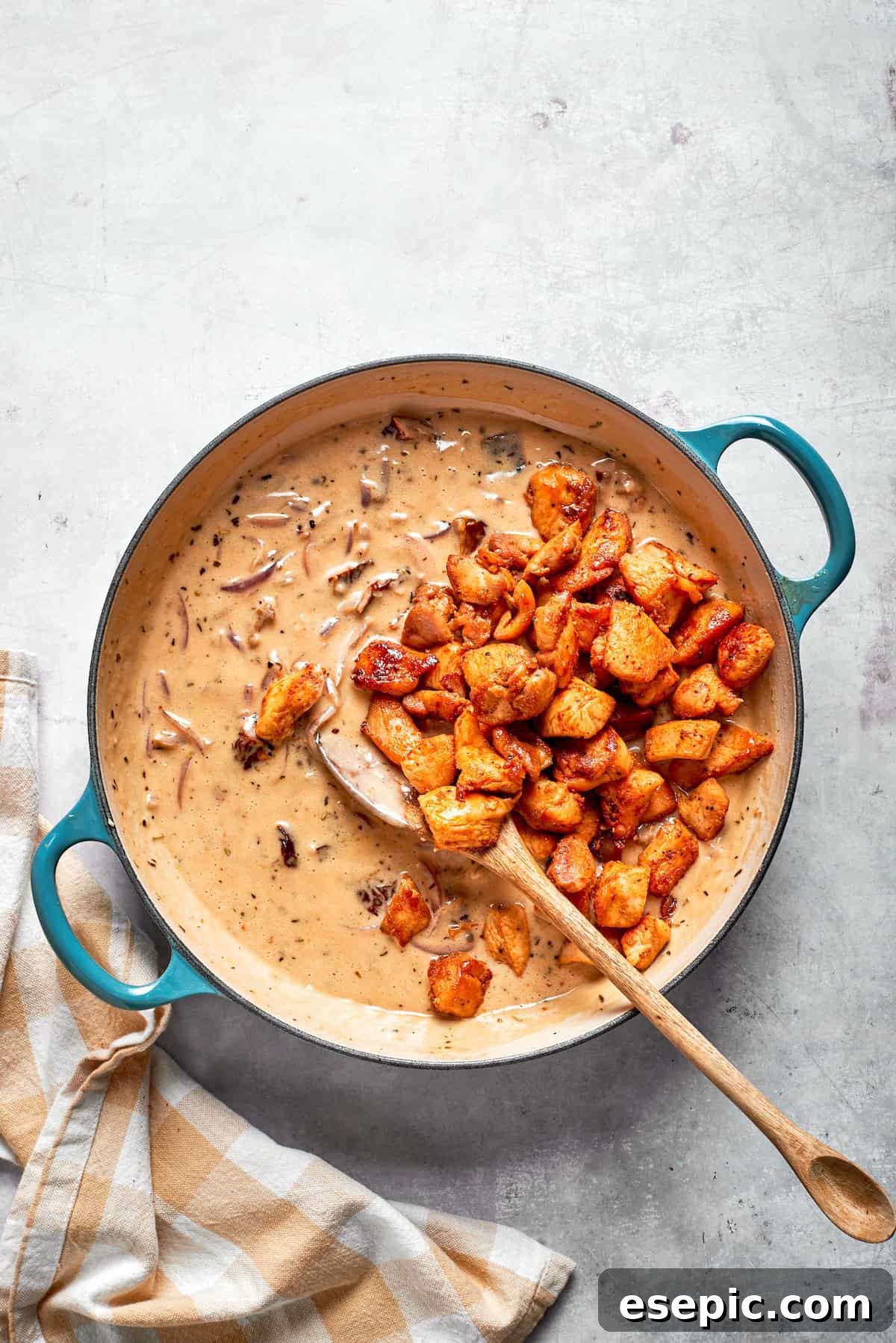 Cheesy, marry me chicken pasta features tender bites of chicken swirled in a creamy sauce along with sundried tomatoes and pasta. Cooked chicken added back to a skillet of cream sauce.
