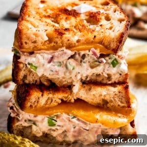 Two halves of tuna melt stacked on top of each other.