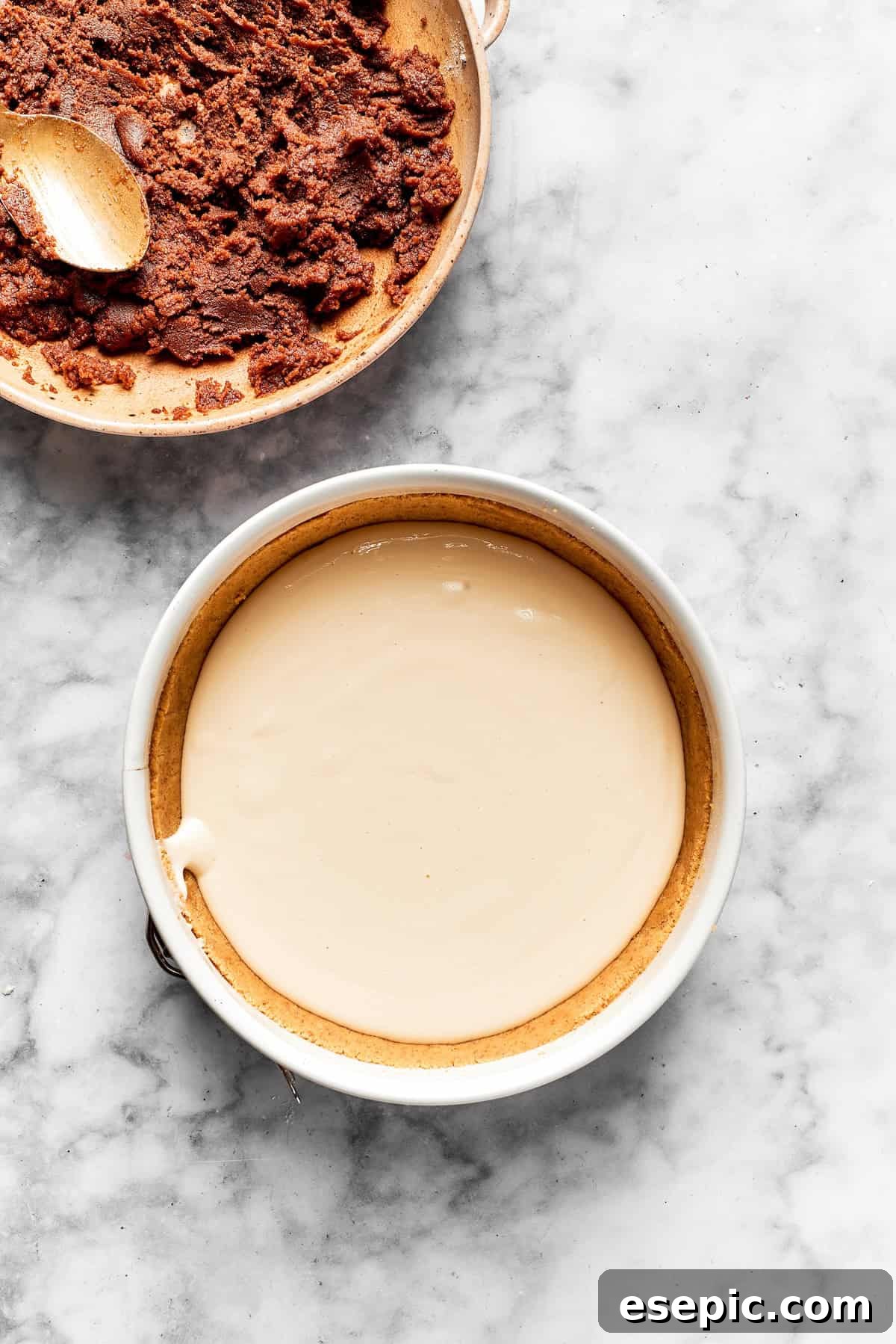 Cheesecake batter is added to a cookie crust.