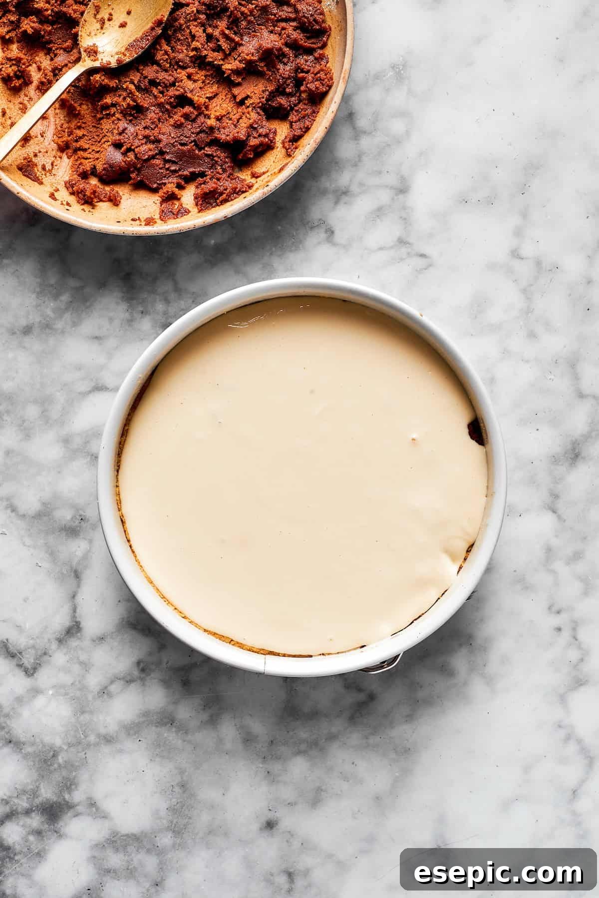A cinnamon roll cheesecake before being baked.