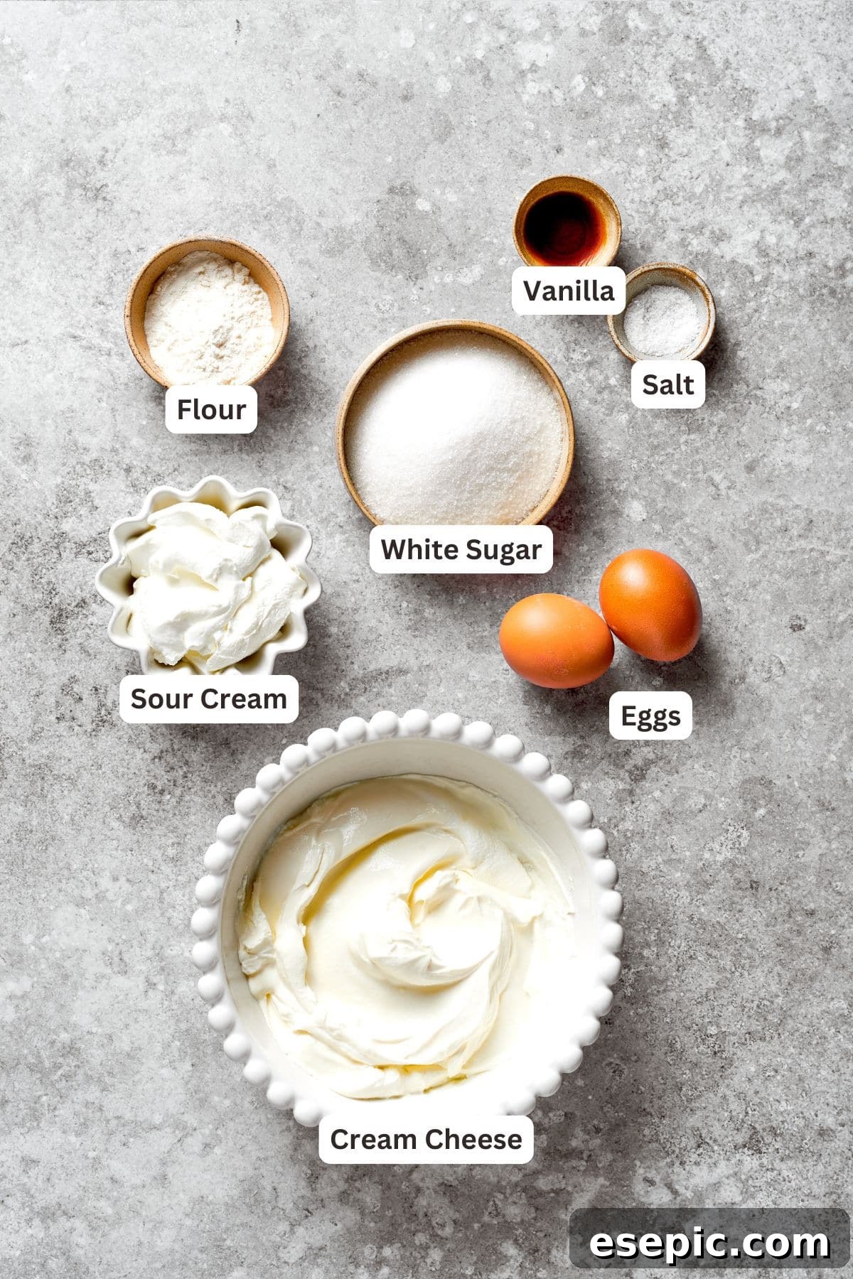 Ingredients for cheesecake batter displayed.