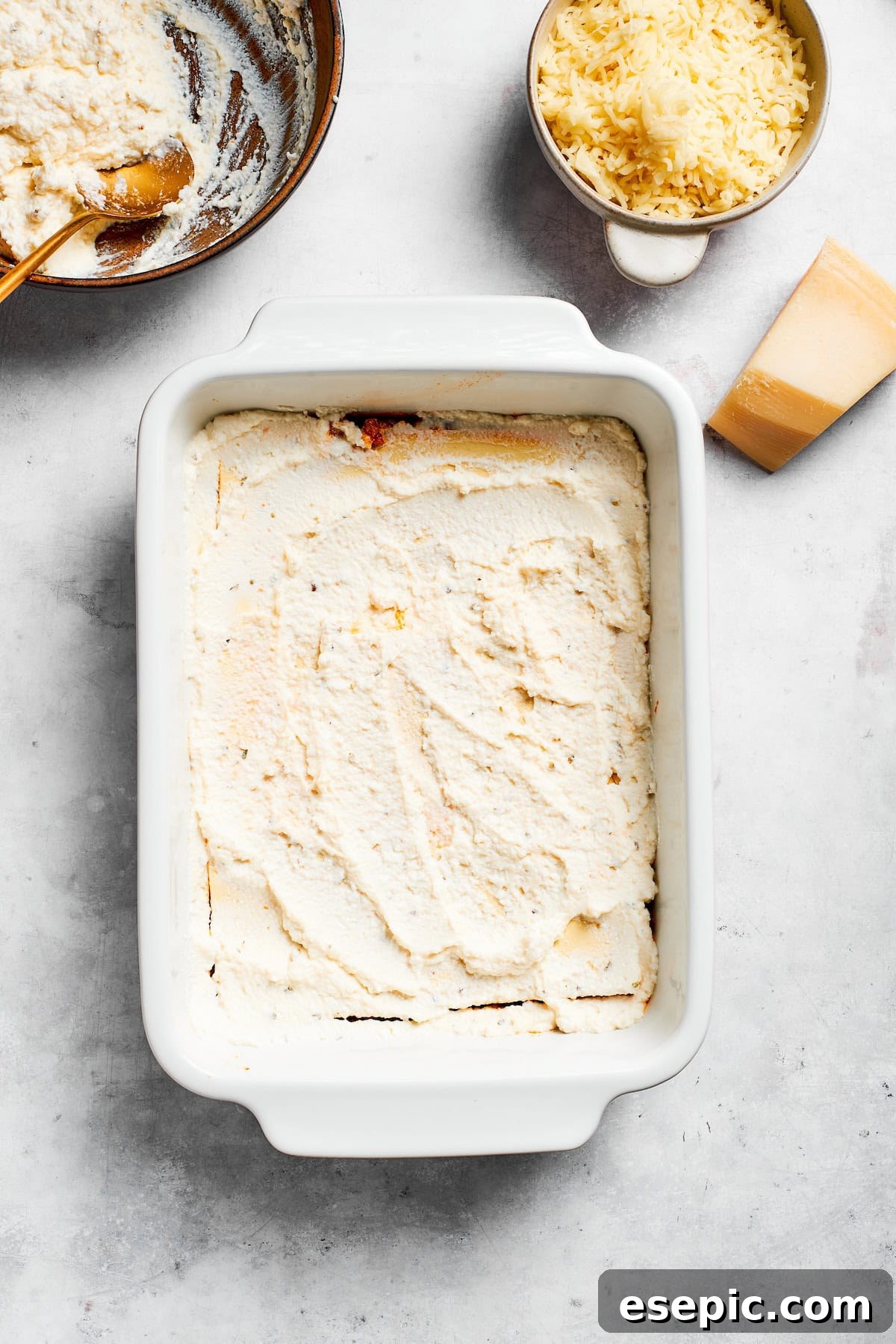 The best beef lasagna recipe is packed with tons of meaty, cheesy flavor and a rich and savory sauce. Make ahead friendly! Creamy ricotta cheese mixture spread evenly over a layer of lasagna pasta in a baking dish.