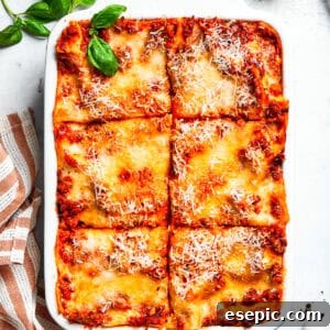 The Ultimate Homemade Beef Lasagna 2 A pan of beef lasagna cut into squares, ready to serve.