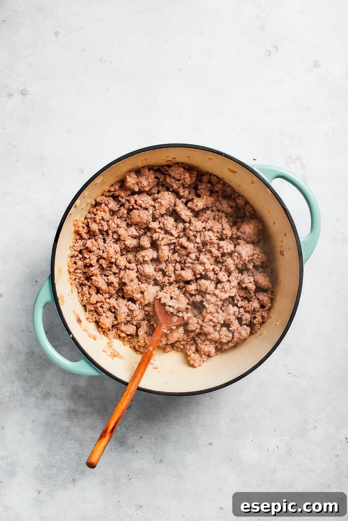 The best beef lasagna recipe is packed with tons of meaty, cheesy flavor and a rich and savory sauce. Make ahead friendly! Lean ground beef browning in a skillet with sautéed onions, ready to form the savory meat sauce.