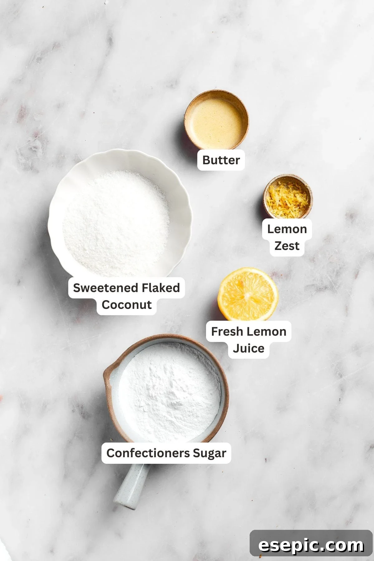 Labeled ingredients for the lemon slice icing, showing powdered sugar, fresh lemon juice, melted butter, and additional lemon zest.