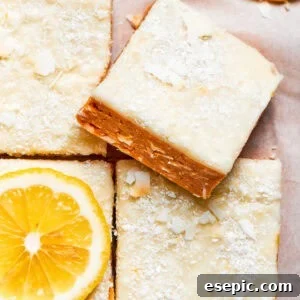 A square of lemon slice on top of other lemon slices, showcasing its inviting texture and bright color.