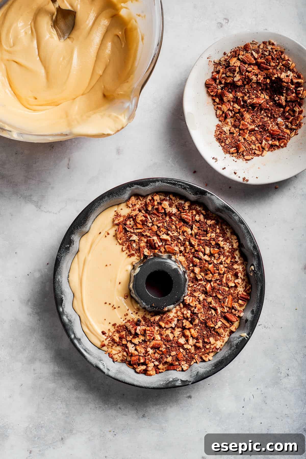 An easy recipe for Sock It To Me Cake, a tender coffee cake with a ribbon of brown sugar, cinnamon and toasted pecans through the center. Filling is added to cake batter for sock it to me cake.