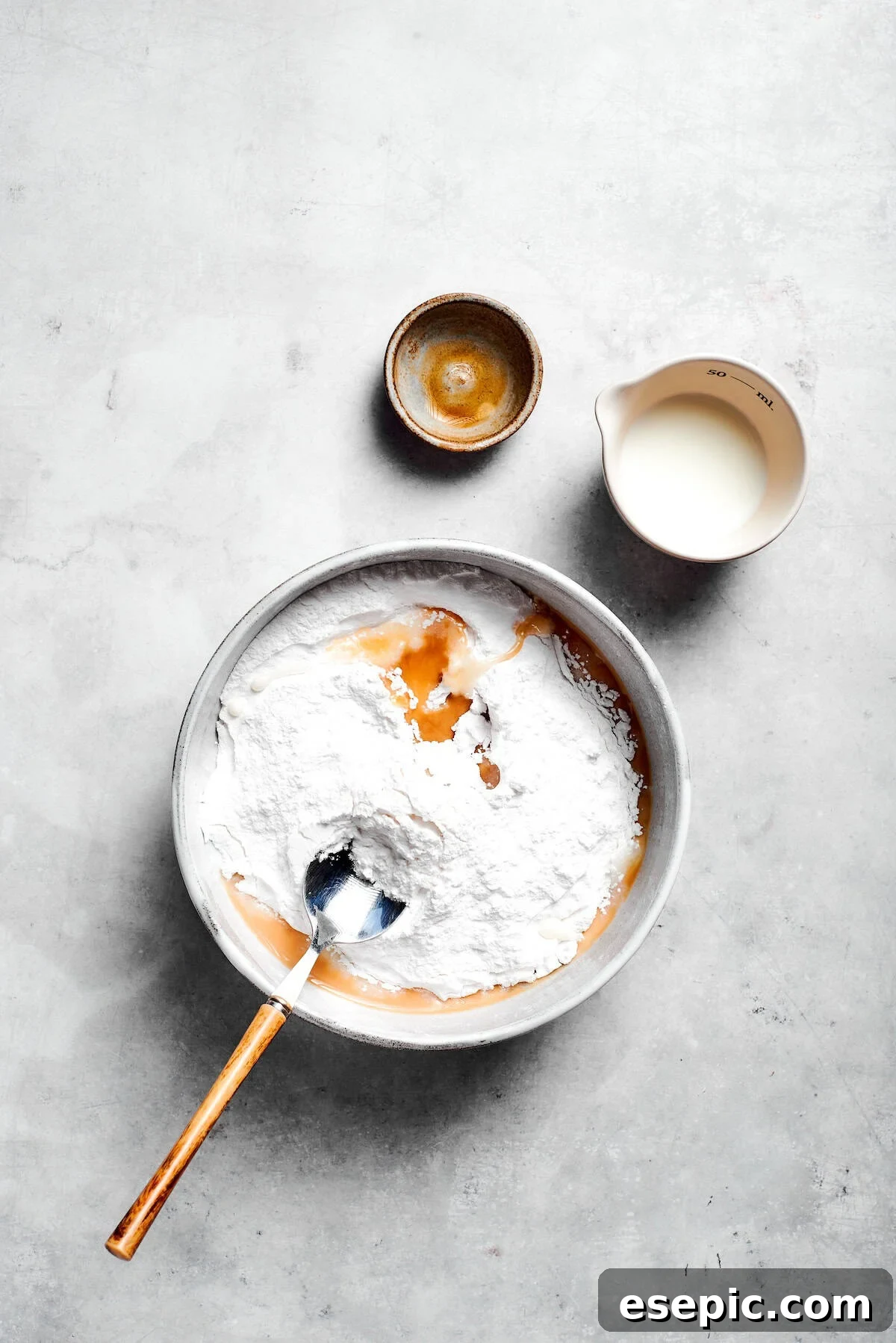 Knock Your Socks Off Cake 4 Icing is mixed in a bowl.
