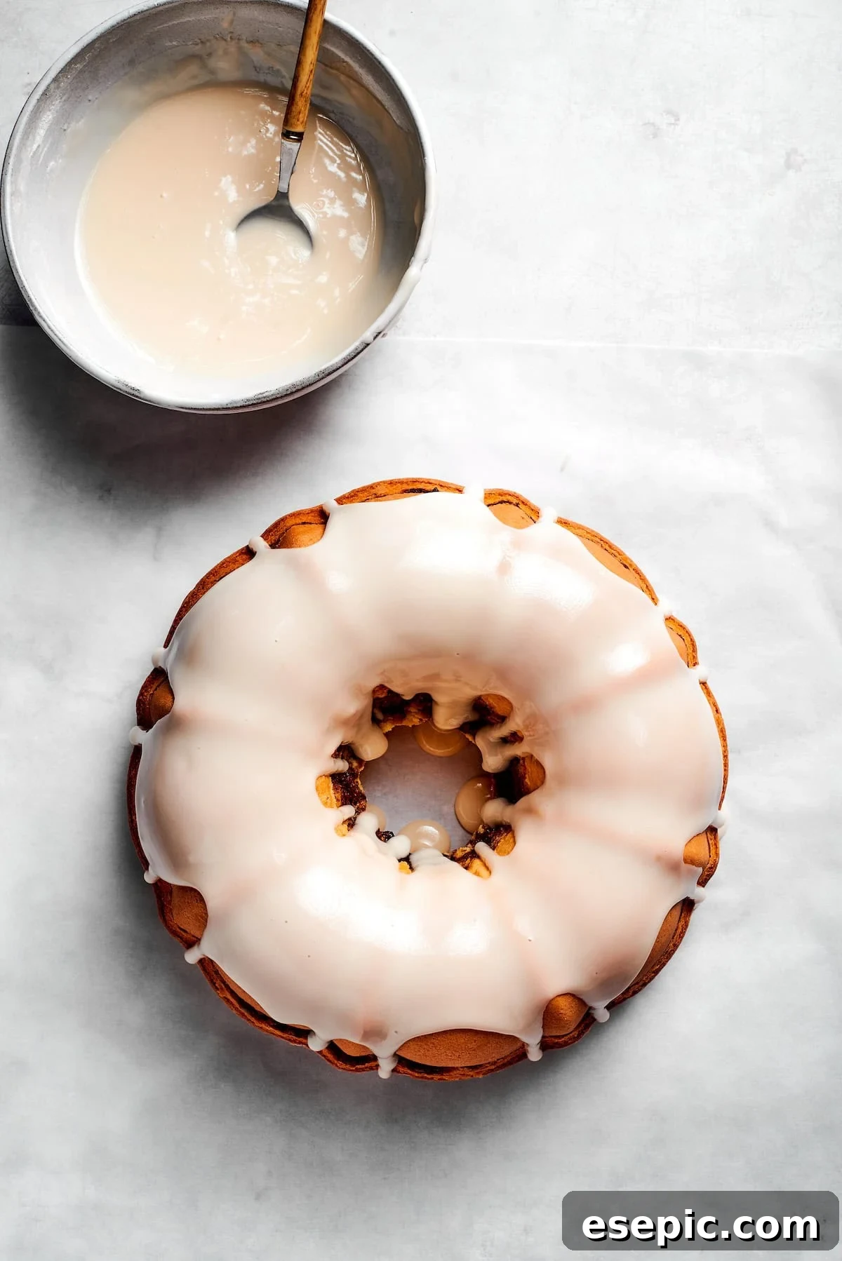 An easy recipe for Sock It To Me Cake, a tender coffee cake with a ribbon of brown sugar, cinnamon and toasted pecans through the center. Icing is added to sock it to me cake.