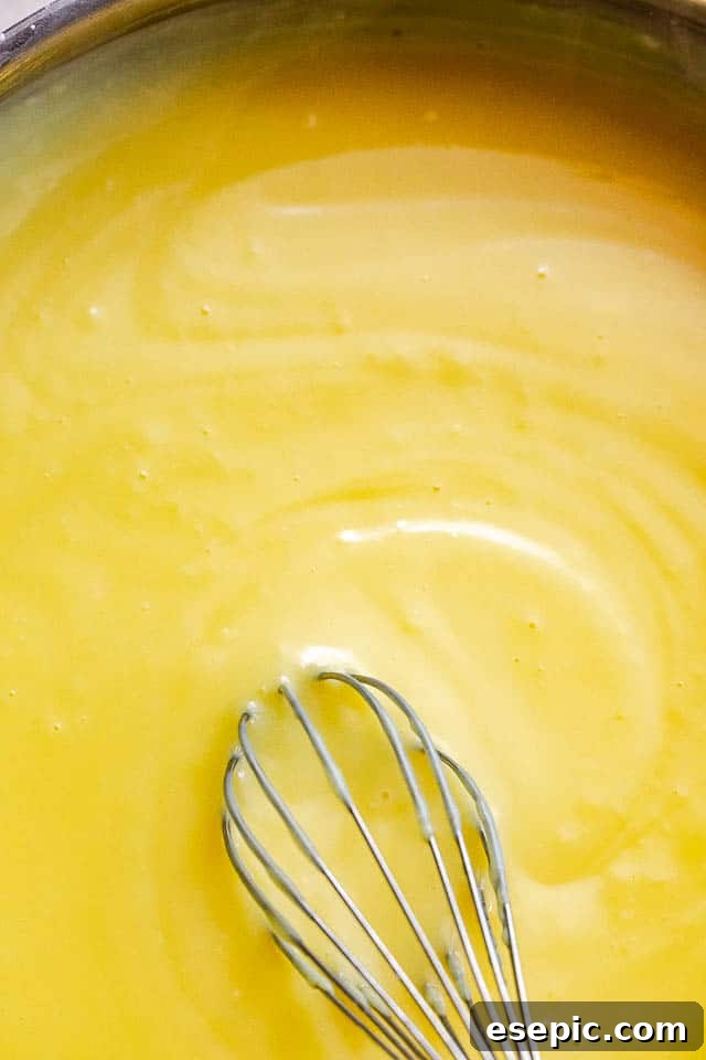 whisking homemade vanilla pudding
