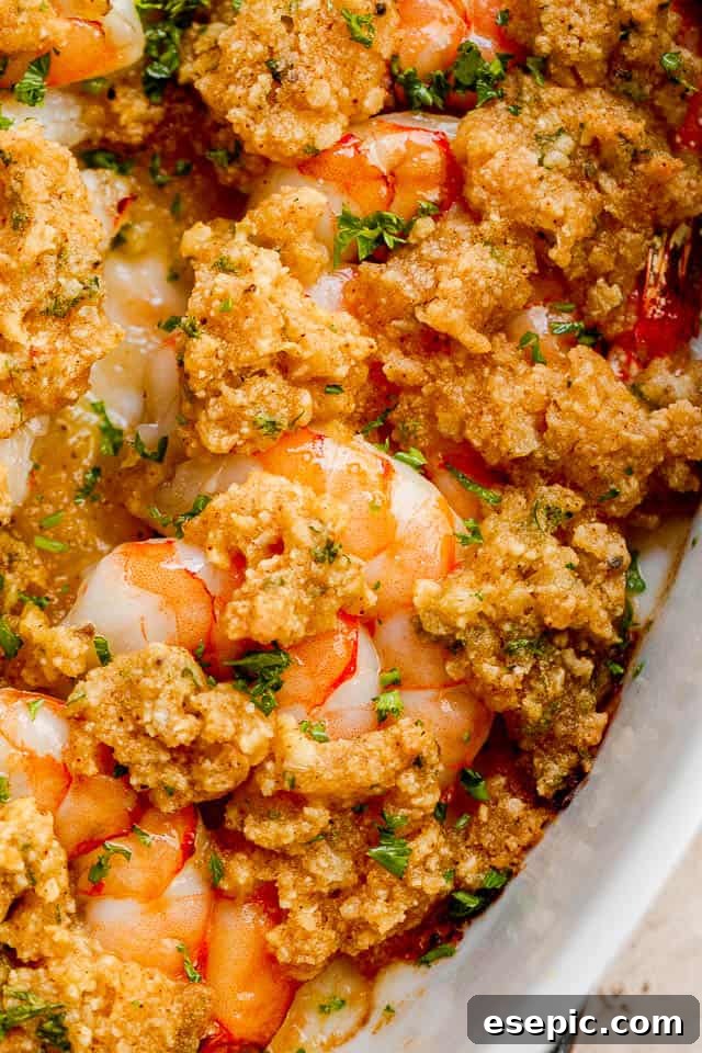cooked shrimp topped with dollops of garlic herb butter.