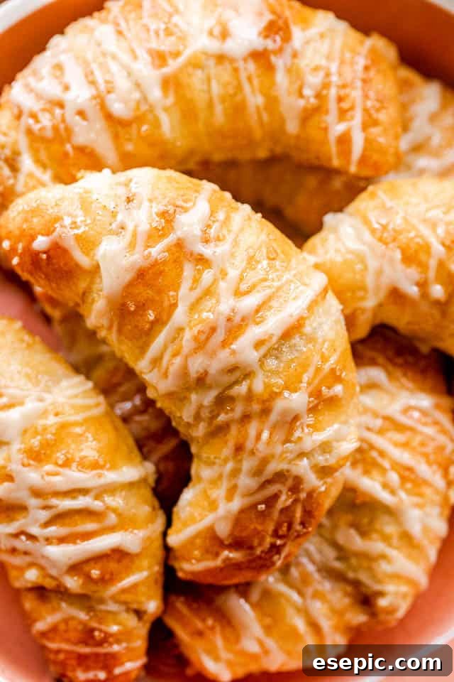 prepared pumpkin crescent rolls in an orange bowl