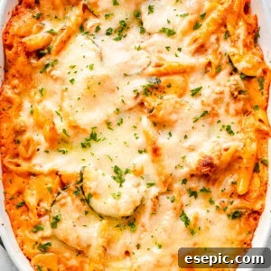 overhead shot of a cheesy baked pasta and zucchini casserole