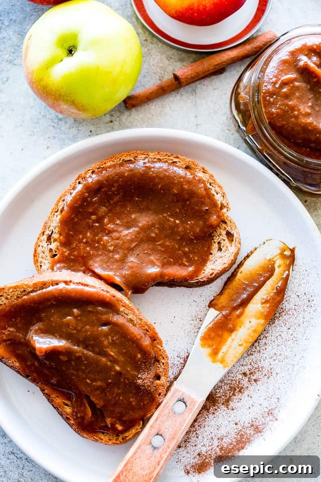 Overhead shot of Instant Pot Apple Butter generously spread on sliced bread, ready to be eaten.