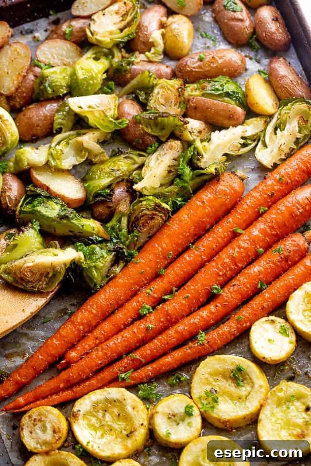 overhead shot of roasted vegetables on a baking sheet