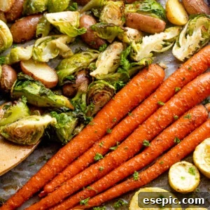 overhead shot of roasted vegetables on a baking sheet