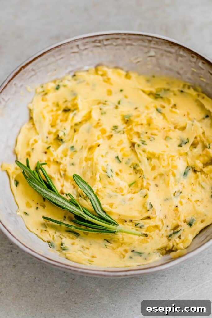 Succulent Whole Roasted Turkey 5 A bowl of softened butter mixed with finely chopped fresh rosemary, a key component for infusing flavor into the turkey.