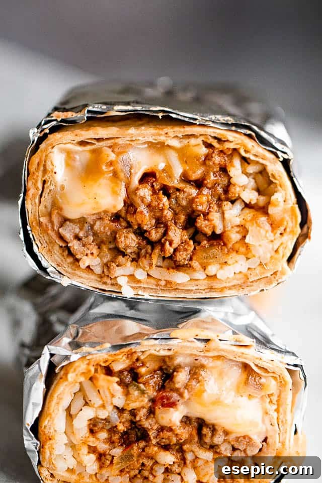 close up shot of two halved burritos stacked one on top of the other