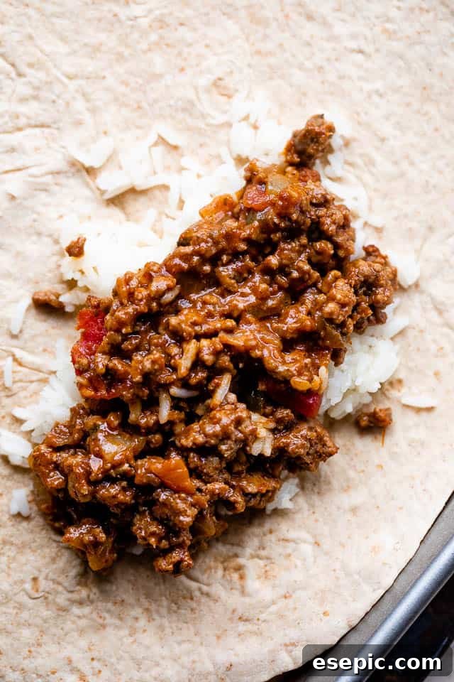 flour tortilla topped with rice and beef