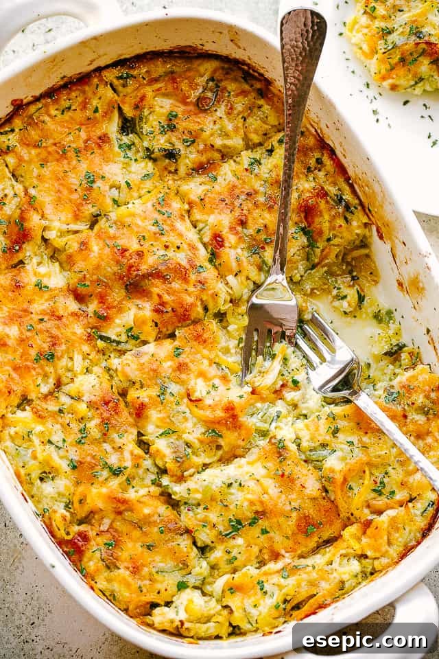Golden Zucchini Squash Gratin 2 Overhead shot of a golden-brown cheesy zucchini and squash casserole in a baking dish, ready to be served