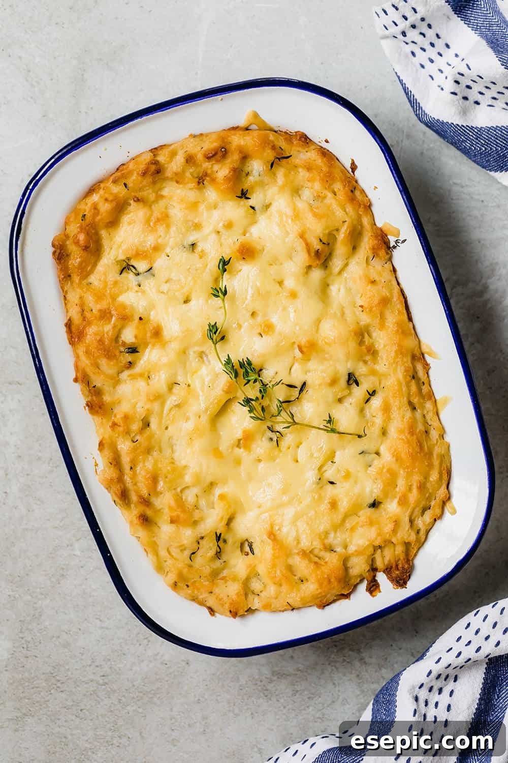 Baked mashed potatoes in a casserole dish.