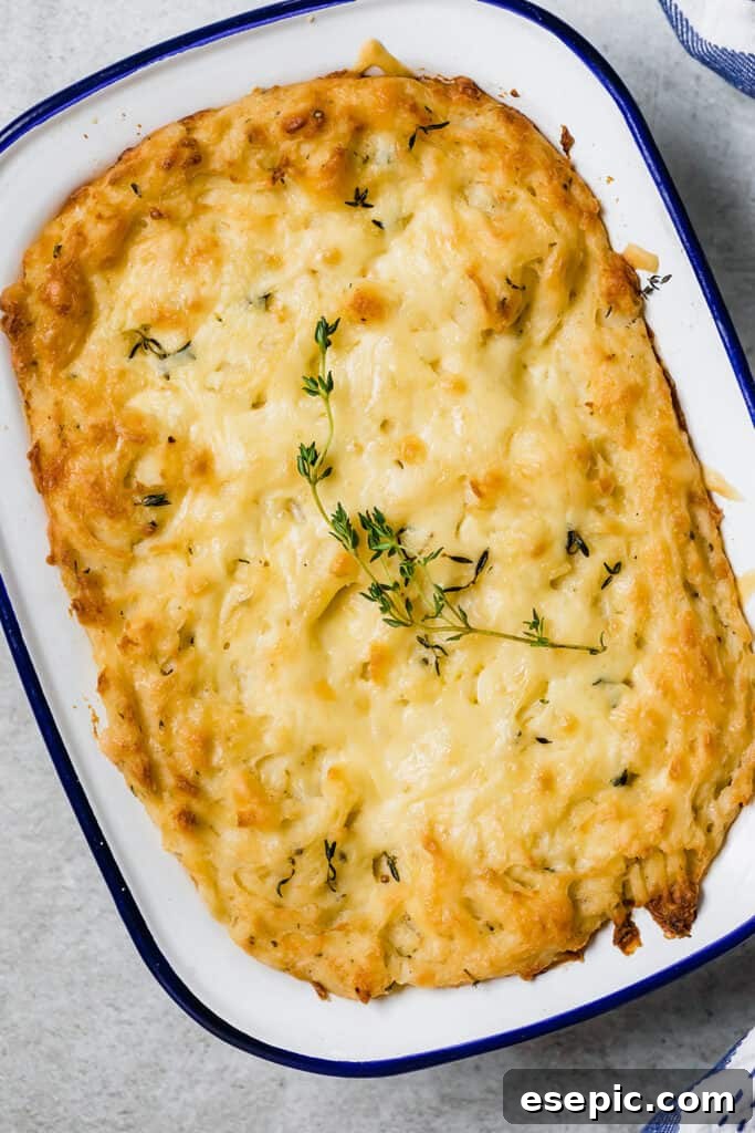 overhead shot of baked mashed potatoes in a white baking dish