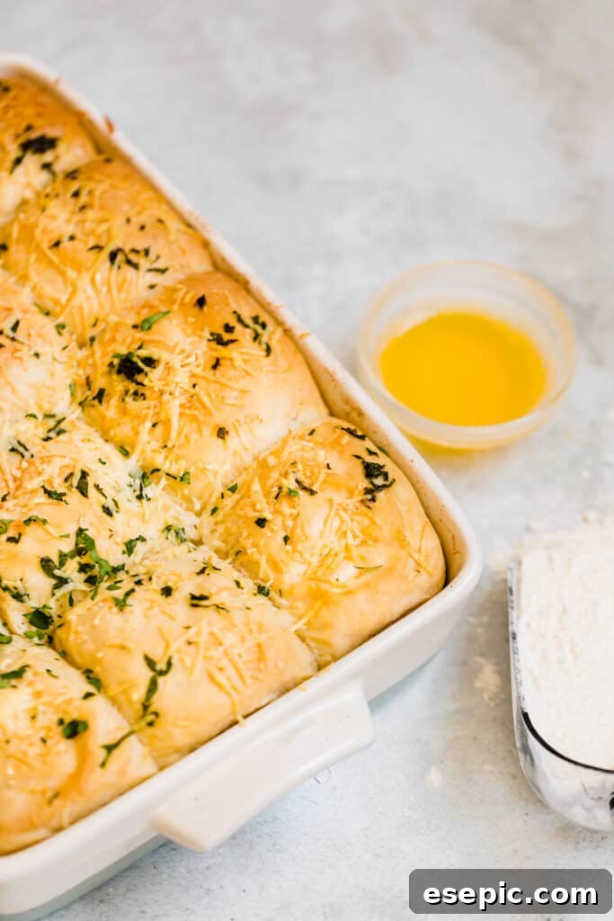 Golden-Brown Soft Parmesan Dinner Rolls in a Large Pan