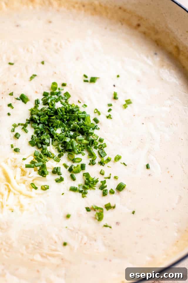 Golden Gnocchi and Crispy Bacon Bake 5 Close-up of a creamy cheese sauce with finely chopped fresh chives stirred in, ready for gnocchi