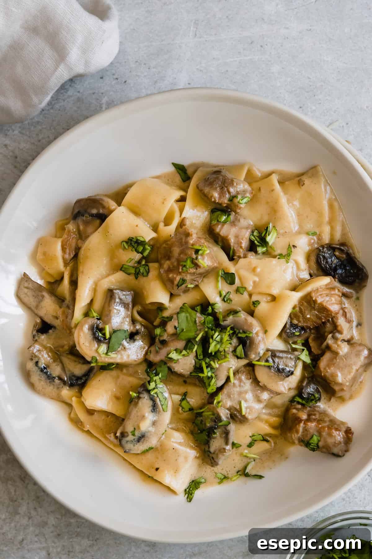 A Plate of Beef Stroganoff Garnished with Fresh Parsley