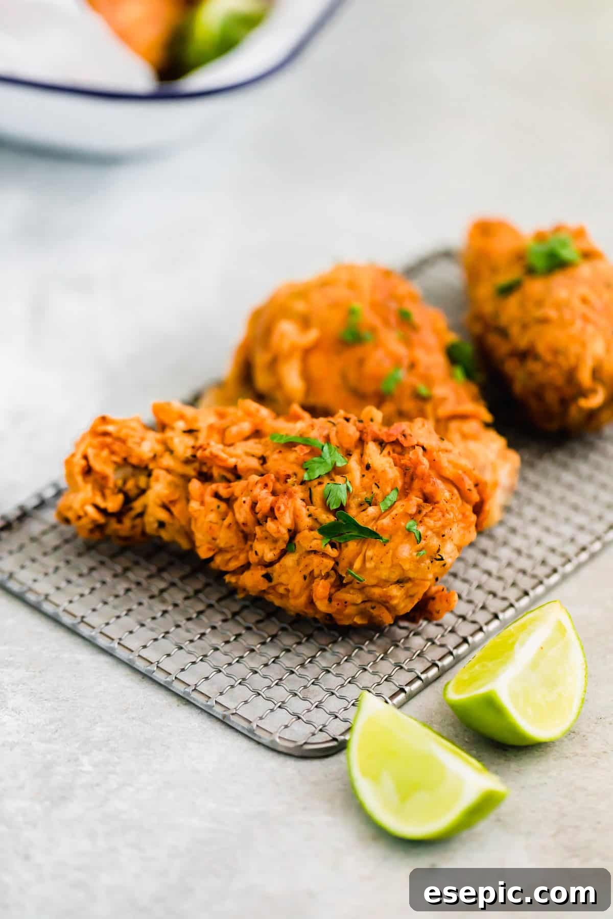 Three Pieces of Buttermilk Fried Chicken Garnished with Chopped Parsley