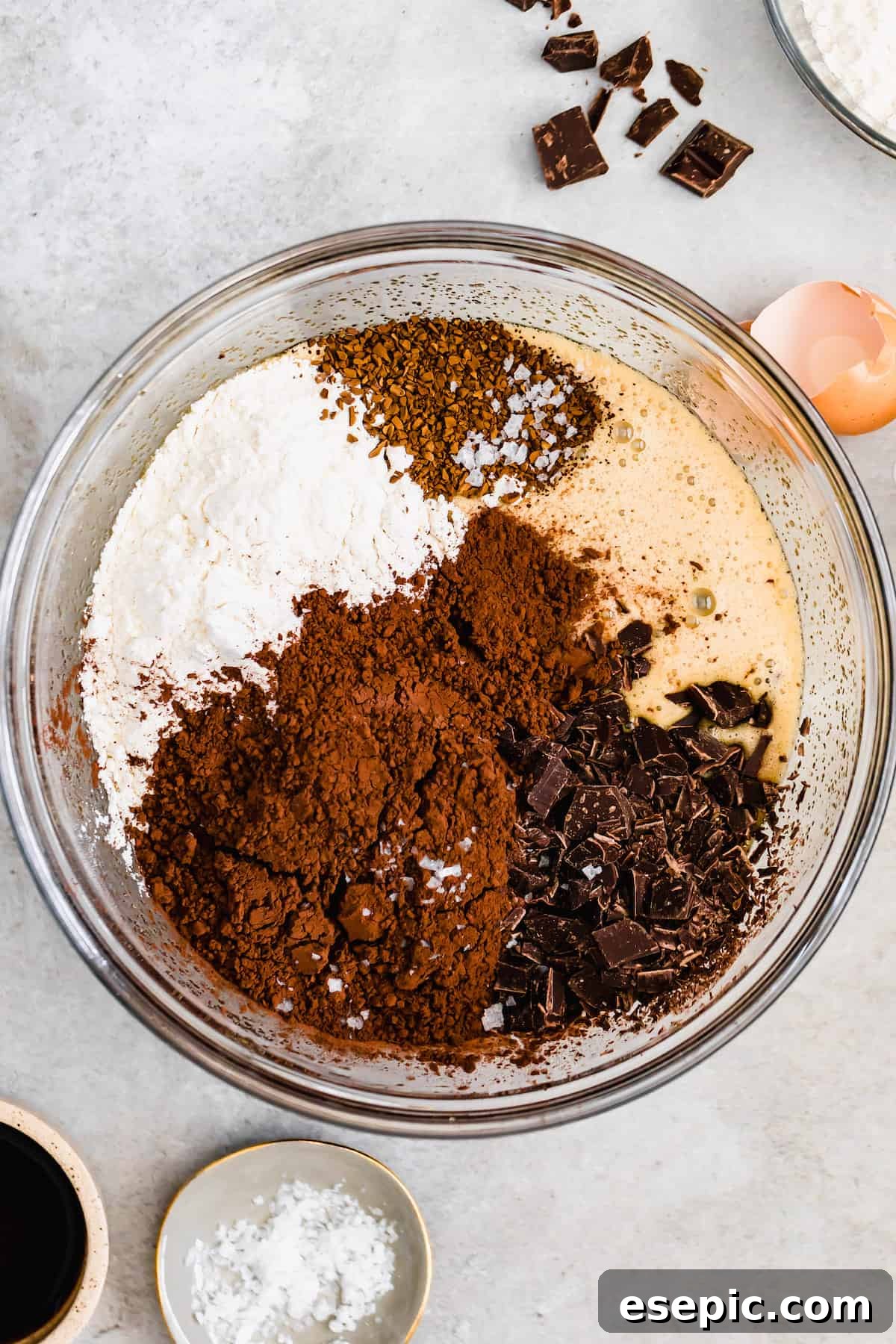 A Glass Bowl of Brownie Batter with the Chocolate and Dry Ingredients Added, But Not Mixed In, showing distinct layers