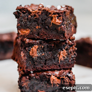 Three Milk and Dark Chocolate Brownies Stacked on Top of Each Other