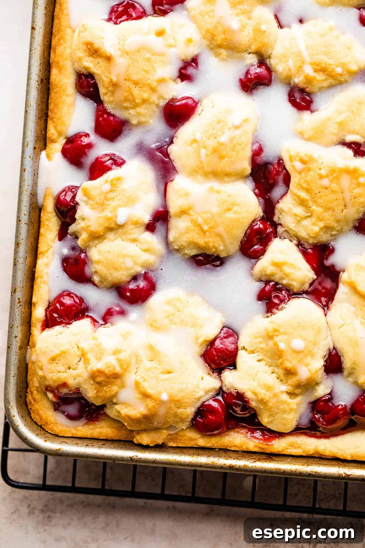 A Pan of Cherry Kuchen Bars Drizzled with Homemade Icing