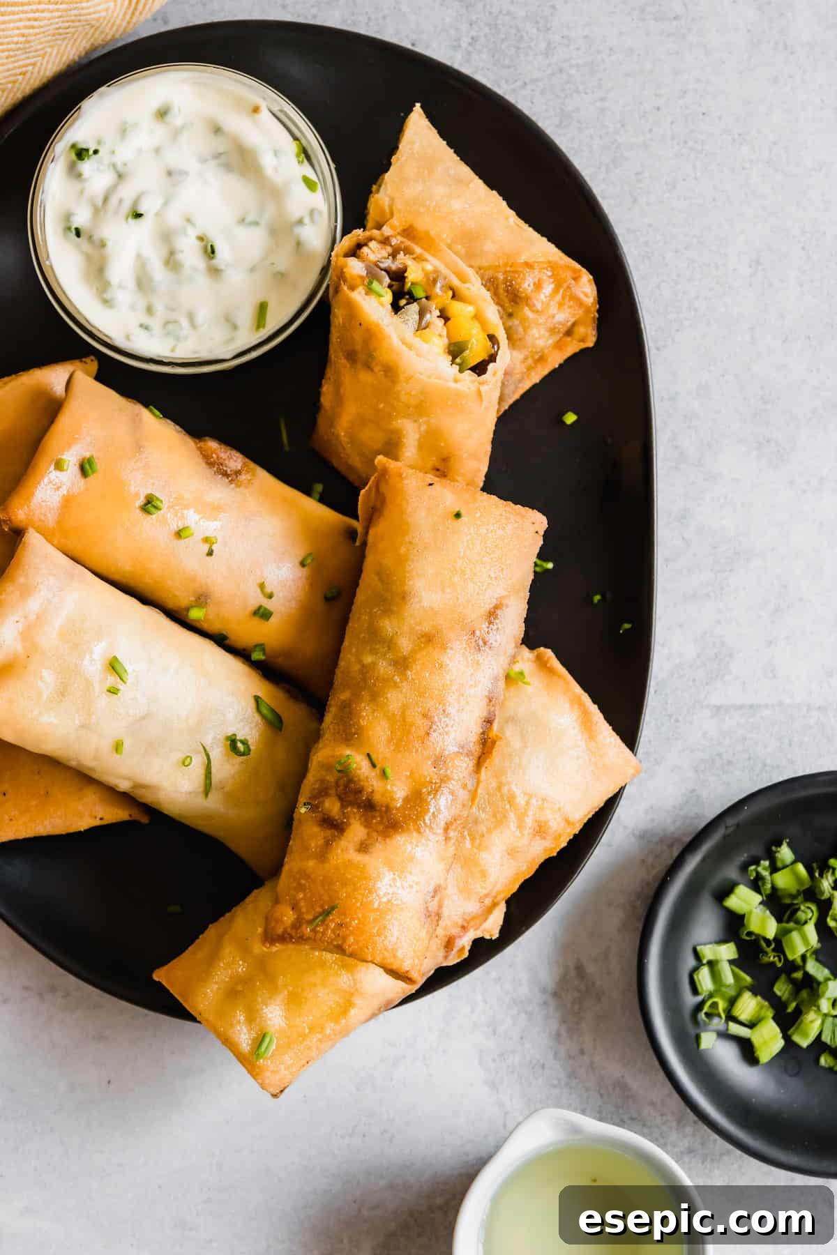 A Platter of Homemade Egg Rolls on a Gray Countertop