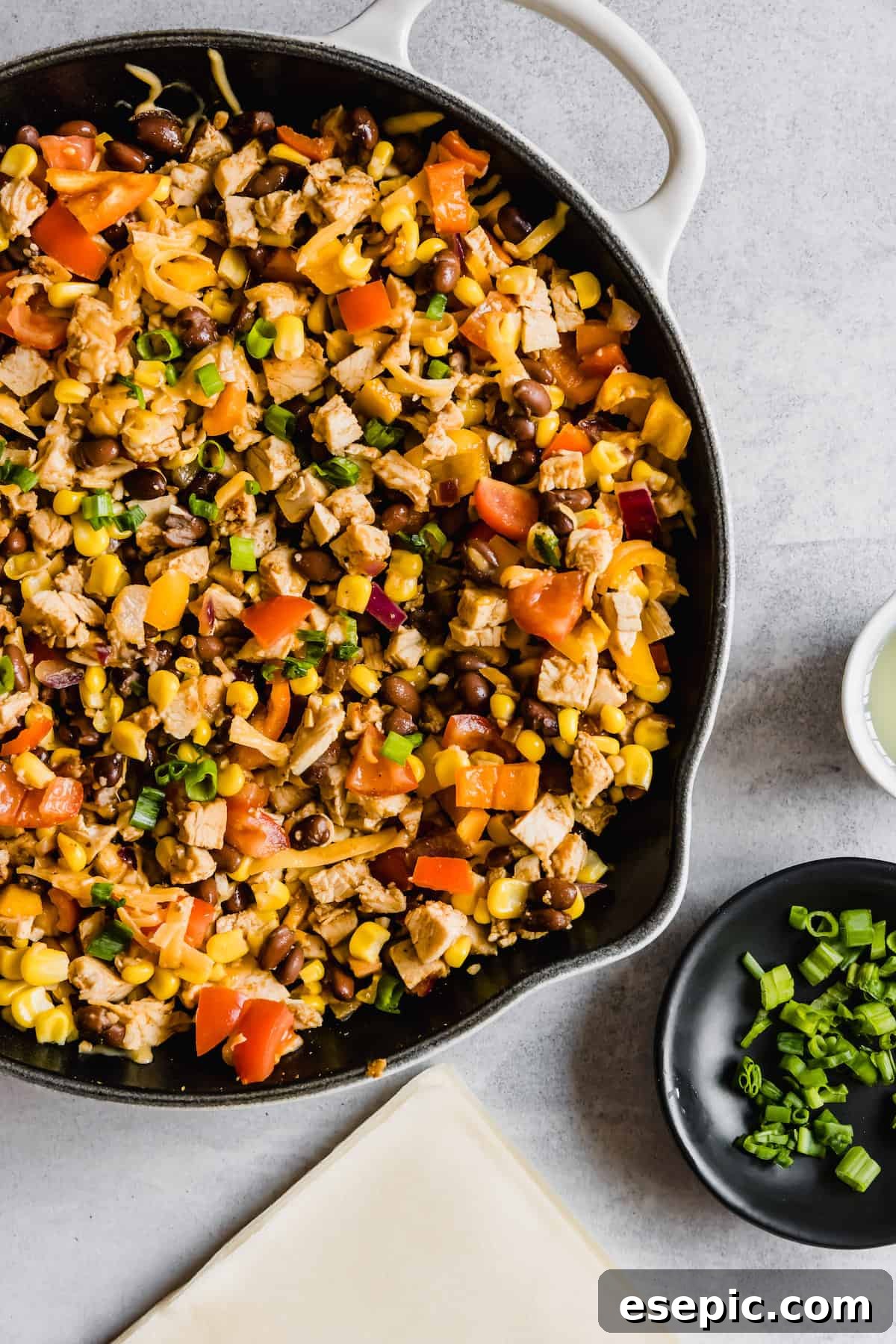 A Metal Skillet Filled with the Chicken and Veggie Egg Roll Filling