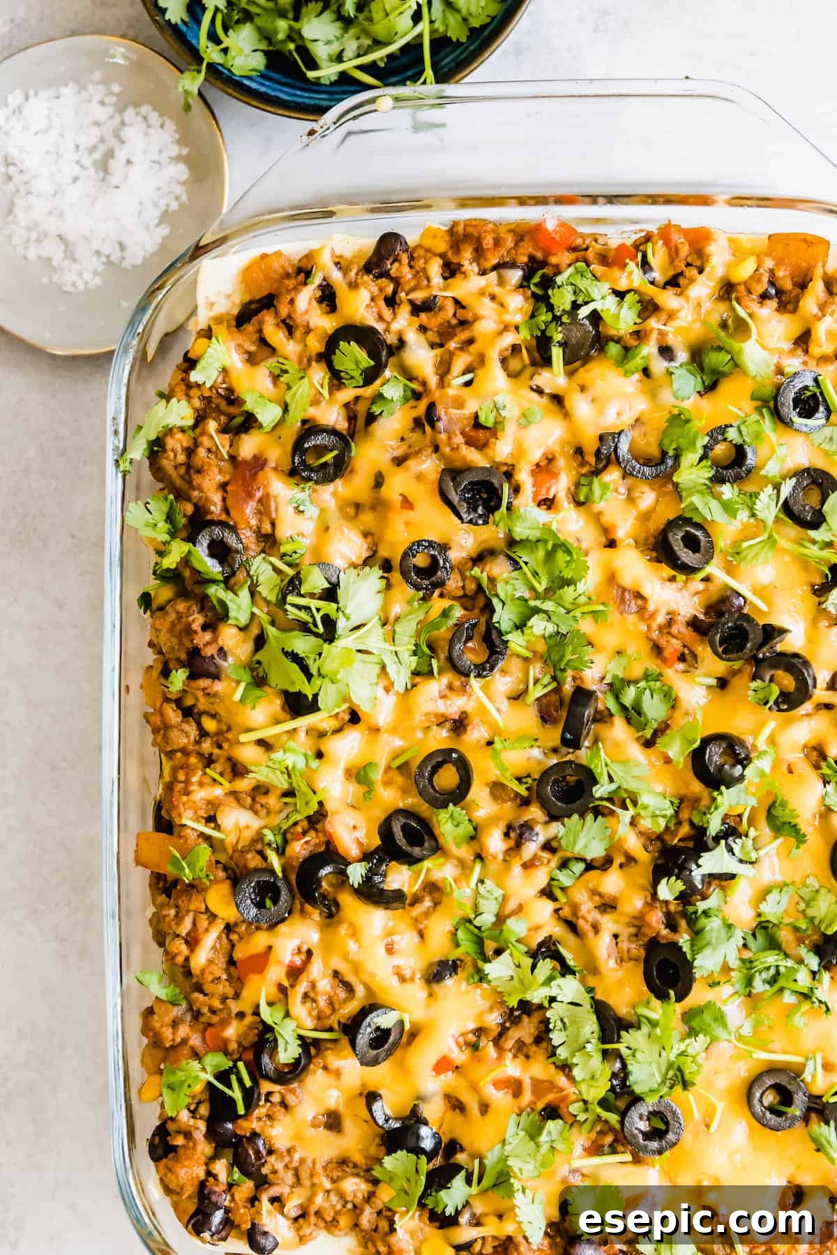 A Mexican Lasagna Casserole in a Clear Baking Dish