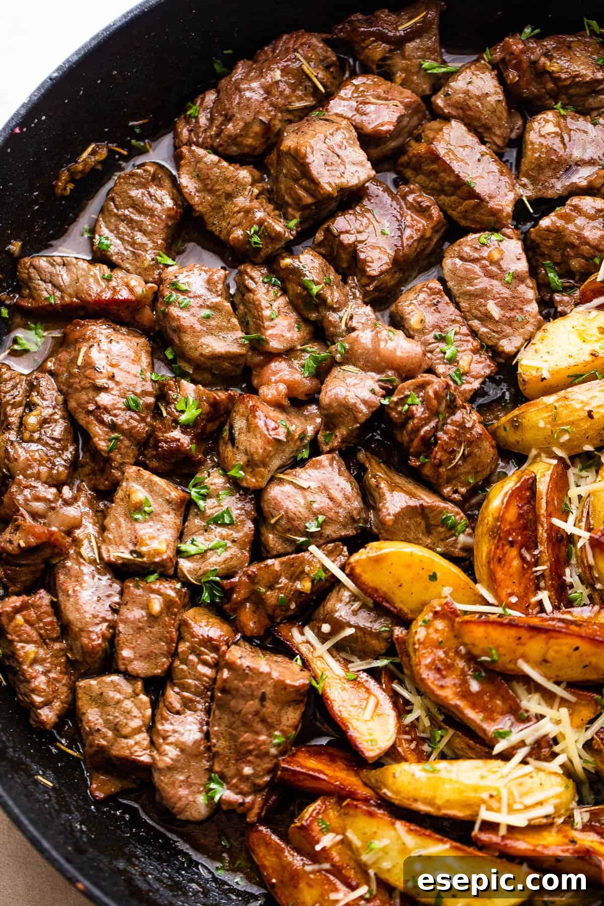 Garlicky Steak Bites and Crispy Potatoes 3 up close photo of browned steak bites
