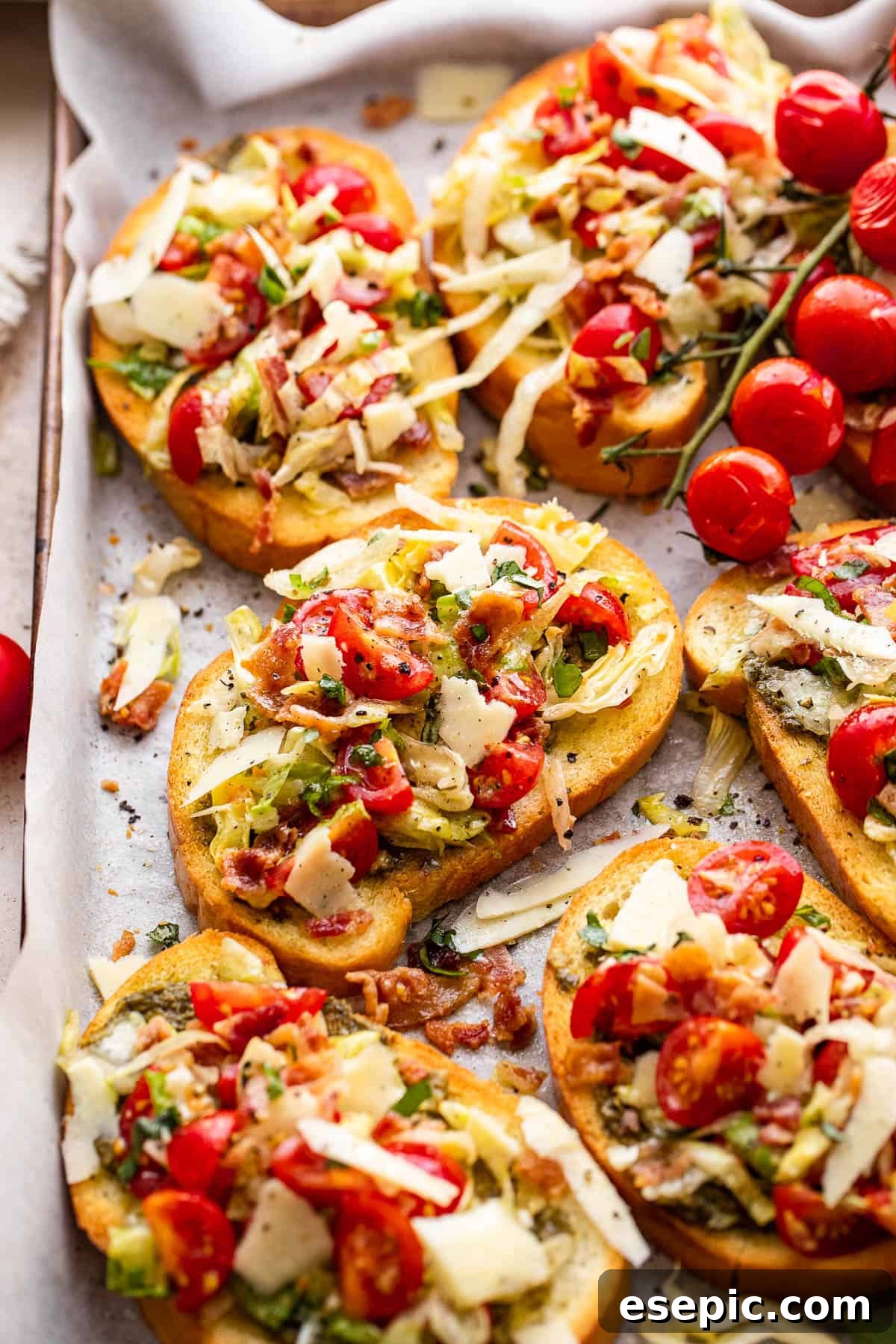 bacon, lettuce, and tomato topped toasted bread slices served on a tray