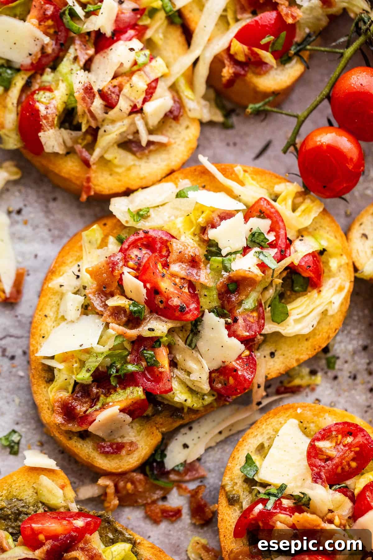 toasted bread topped with bacon, lettuce, and tomato salad