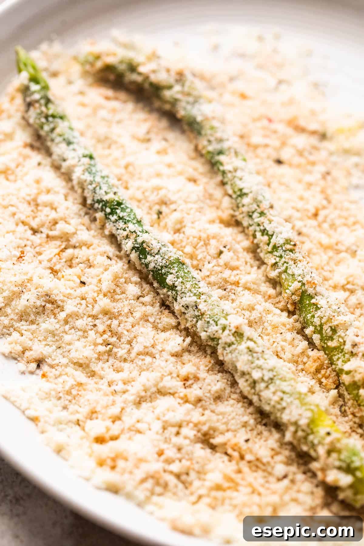 Crispy Parmesan Panko Asparagus Sticks 4 rolling fresh asparagus spears in panko bread crumb mixture