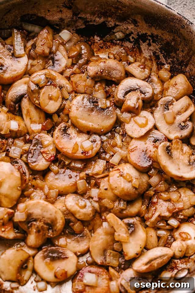 Preparing the rich and savory mushroom gravy in a skillet.